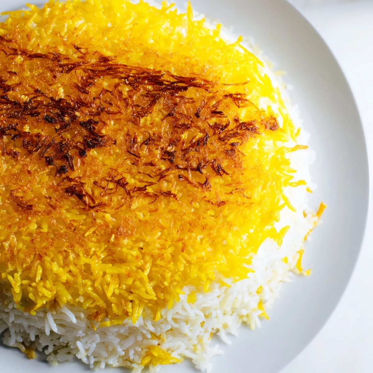 Golden, crispy Tahdig rice, a Persian delight, ready to be flipped and served gloriously.