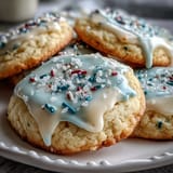 Soft, tender lemon cookies topped with colorful pastel glaze, ideal for festive spring dessert tables.
