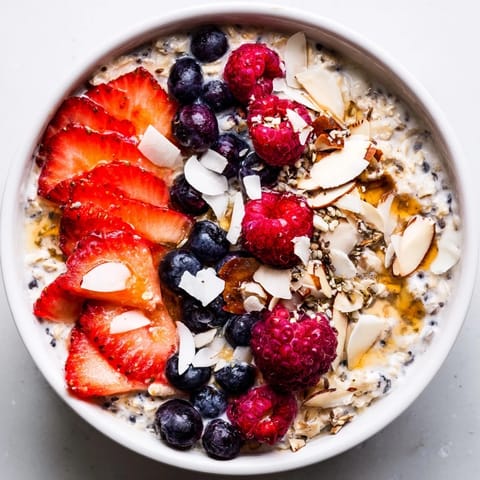 Bright, fresh berries topping a bowl of overnight oats with chia seeds, ready to enjoy.