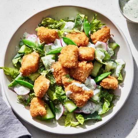 This Green Goddess Nugget Salad showcases golden nuggets alongside vibrant vegetables and creamy dressing.
