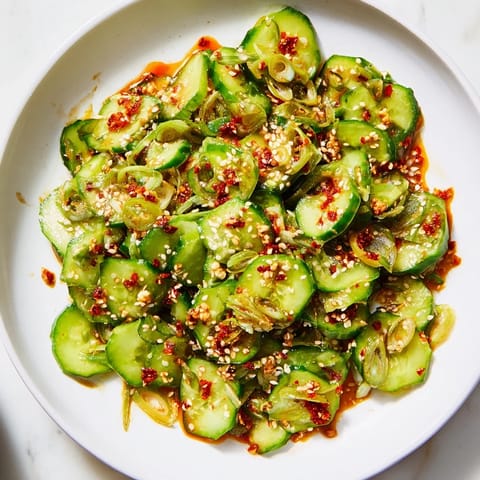 Savory Cucumber Shaker, featuring vibrant green cucumbers tossed in tangy rice vinegar dressing.