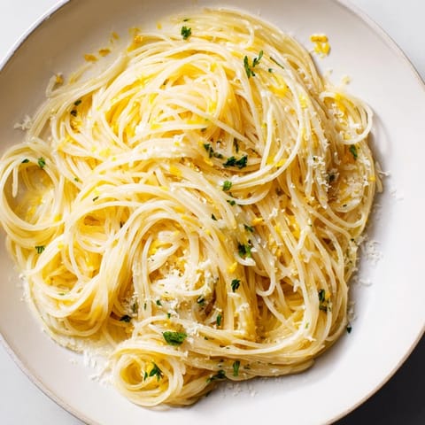 Lemon Butter Pasta Light served warm in a white bowl, a bright and zesty vegetarian main dish perfect for a quick, light meal.