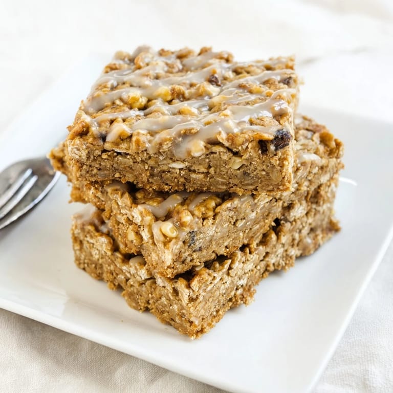A close-up shot of delicious, chewy maple cinnamon oatmeal bars, ideal for a wholesome treat.