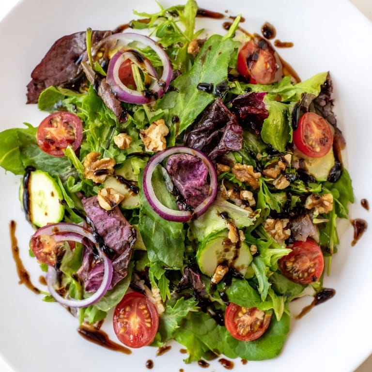 A beautiful Quick Balsamic Vinegar Salad, prepared with fresh greens and a glossy balsamic reduction dressing.