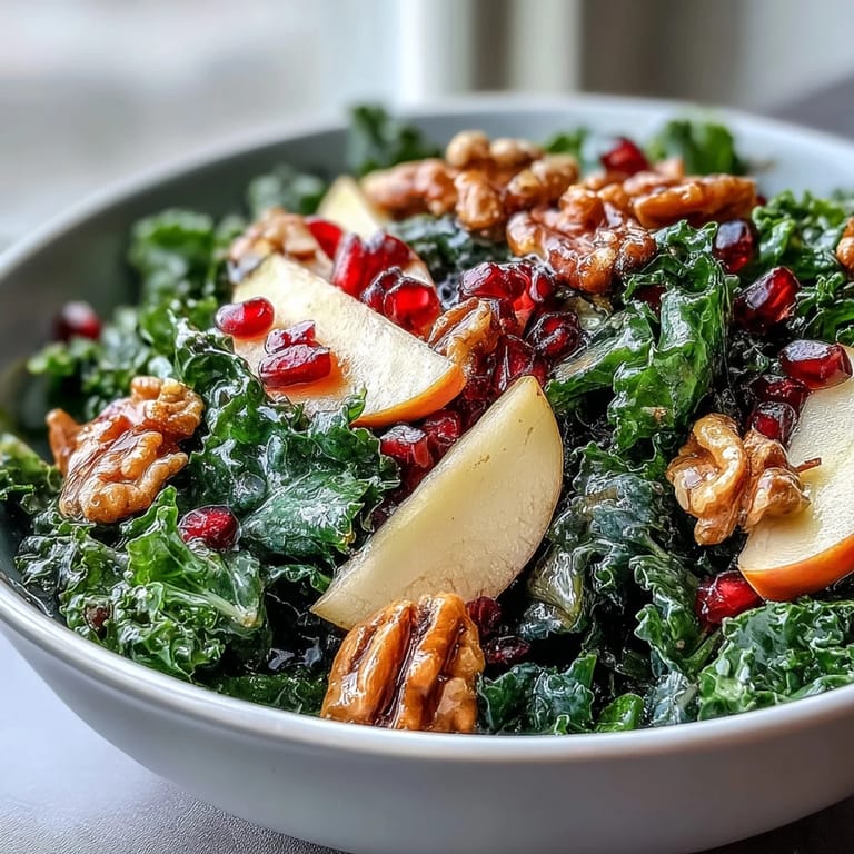 Healthy Kale and Pomegranate Bowl with tender kale, juicy seeds, and crisp apple, ready for a light lunch.