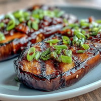Tender miso glazed eggplant, caramelized with savory-sweet goodness, ready to serve.